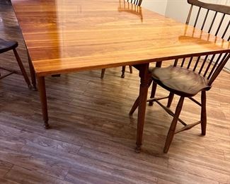 Stickley dropleaf table, completely extended shown with two chairs