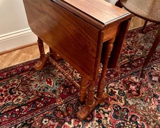 Small walnut drop leaf table in the style of Stickley. No label attached.