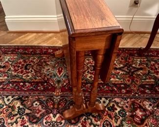 Small walnut drop leaf table in the style of Stickley. No label attached.