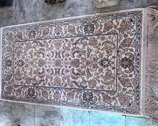 Karastan runner has slat damage to one side of binding 