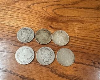Heavily worn silver dollars