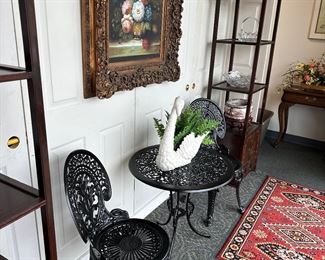 antique black wrought iron chairs with dolphin feet and table,
