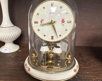 antique porcelain brass anniversary clock with original glass down has been cleaned