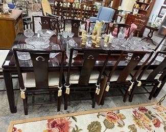 Asian inspired chippendale styled mahogany dining table with eight chairs, by Martin Furniture company. Includes table pads