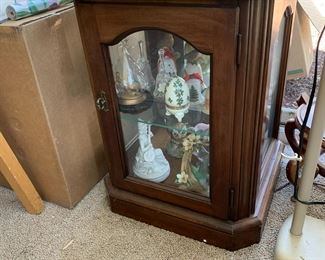 #110	wood and glass display end table with a round piece of glass on top with 1 glass shelf 18x18x24with 24 inch round glass 	 $75.00 			
