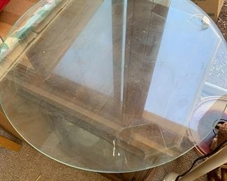 #110	wood and glass display end table with a round piece of glass on top with 1 glass shelf 18x18x24with 24 inch round glass 	 $75.00 			
