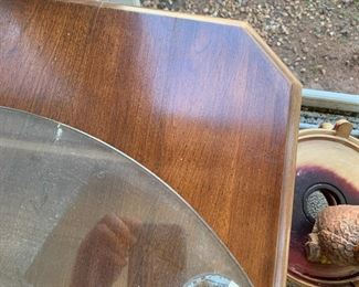 #110	wood and glass display end table with a round piece of glass on top with 1 glass shelf 18x18x24with 24 inch round glass 	 $75.00 			
