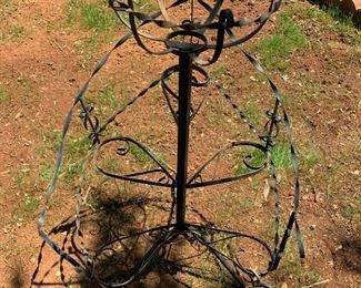 #132	black metal stand with stairs 	 $20.00 			
