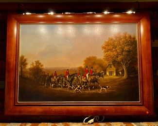 Oil on canvas “Fox Hunt With Riders” in wood frame with gilt trim.