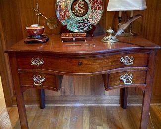 Circa 1770 English Mahogany Chippendale style serpentine writing table with chambered legs.