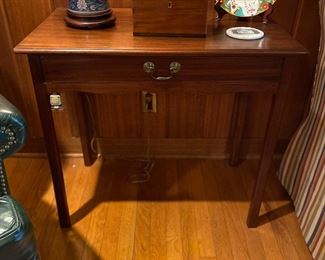 Circa 1780 English Mahogany side table with drawer, shaped apron, and straight legs.