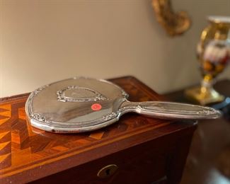Sterling hand mirror with monogram.