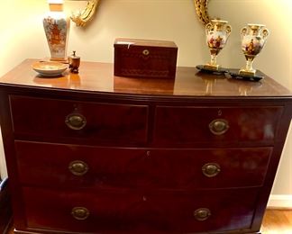 English mahogany four drawer chest with splay legs. Circa 1860.