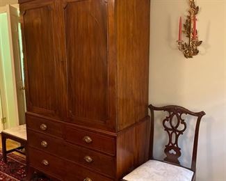 English Mahogany Gentleman’s Press, blind door cupboard above, four drawers below, splay feet. Circa 1800.