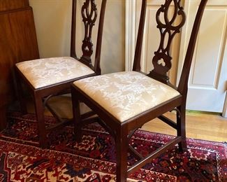 Pair of English Mahogany side chairs with shaped crest, pierced splat, straight square legs. Circa 1780.