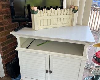 White painted cabinet and electronics