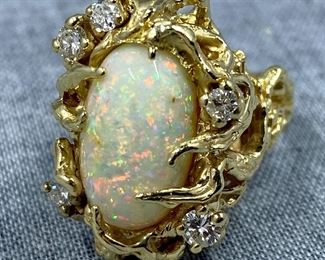 NOT ON-SITE OUTSIDE OF SALE HOURS. Premises are under 24-hour, multi-camera surveillance. Ladies' ring with diamonds and opal stone, 14K yellow gold mounting in a free-form style. 