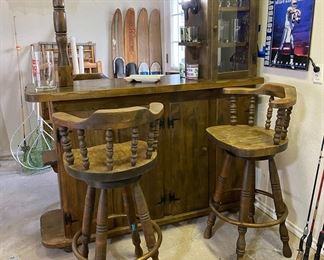 Solid Wood, Detached Tiki Bar with Working Lantern Light, Glass Front Cabinet, and Bottoms Cabinets for Liquor Storage. Set of 4 Wooden Captains Chair Bar Stools.