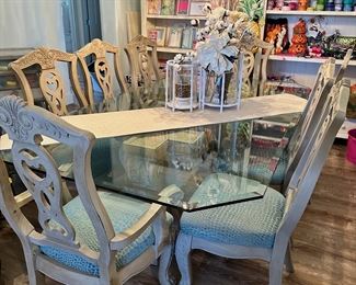 Glass top dining table with 8 chairs. **VERY HEAVY**