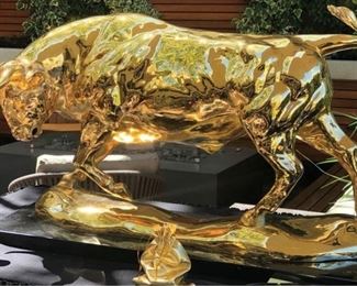 Lorenzo Ghiglieri (1931-2020) "Lorenzo's Bull" - Medium: 24K Gold Plated Bronze - Signed lower center. Measures 21" x 34?.                                                                                                                                                                                                                                    Lorenzo?s work graces the walls of the most prestigious establishments in the world. His sculptures and paintings have been presented to Pope John Paul II at The Vatican in Rome, President Ronald Reagan at the White House, Mikhail Gorbachev of the Kremlin and King Juan Carlos of the Royal Palace in Madrid.Tiger Woods, Luciano Pavarotti and General Schwartzko pf are a few others who take pride in their ownership of a Lorenzo Ghiglieri sculpture.In 1994, Lorenzo sculpted the ?Official American Bald Eagle? in bronze, silver,and gold, now on display at the White House and part of their permanent collection.Later, he was commissioned to complete t
