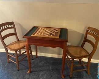 2 antique chairs with the original cane sets! Antique game table sold separately.