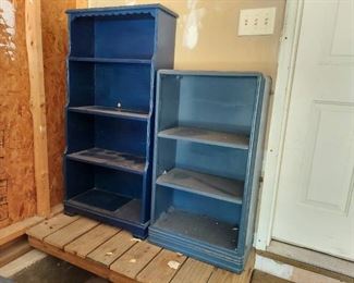 2 blue bookshelves