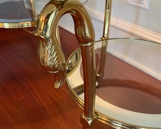 Pr. glass & brass swan side tables    $575.00                                                      20"h x 20" diameter