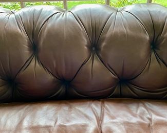 Baker leather tufted sofa                                                                                    32"h x 88" long x43"d