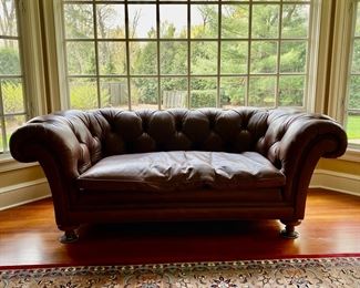 Baker leather tufted sofa                                                                                            32"h x 88" long x43"d
