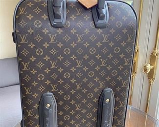 Louis Vuitton suitcase                                                                 23"h x 16"w x 7.75"d  interior strap is detached