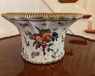 Floral ceramic bowl with metal trim               $200.00                8"h x 15" diameter 