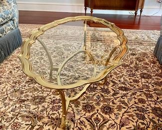 Brass & glass coffee table 48"long x 28"w  $550.00