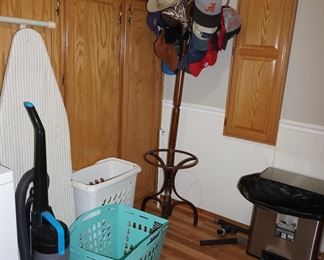 hall tree, laundry supplies, vacuum cleaner