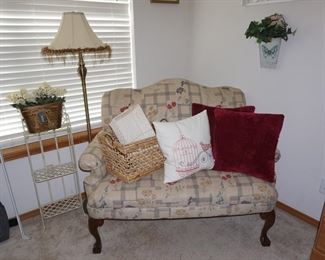 love seat, lamp, pillows