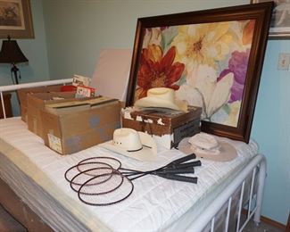 full size bed, books. cowboy hat, decor