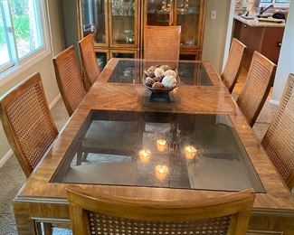 1970's Drexel Heritage Dining Table with Smoky Glass Inserts, 8 Caned Back Side Chairs, Curio Lighted Cabinets