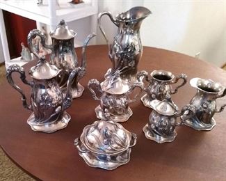 Art Nouveau Silver plate coffee and tea set by Southington & Co. on and antique tea table