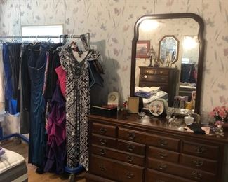 Kincaid dresser.  Rack of ladies clothes including evening wear