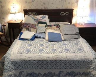 Full size bed.  Headboard, mattress and box spring, quilted coverlet.  Bedsheets and pillowcases, full and twin size