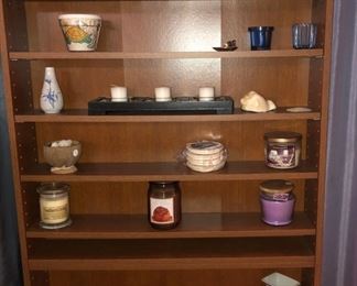 Bookshelf with vases, candles