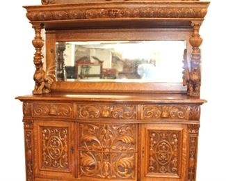 
Lot 503
Antique highly carved and ornate Wing Griffin oak buffet with mirror back 1 drawer hutch top, very nice model with drawer in hutch
