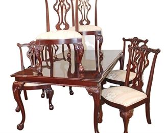 
Lot 560
Beautiful Thomasville banded burl mahogany Chippendale style ball/claw dining room table with 20" leaf, custom table pads and 6 chairs
