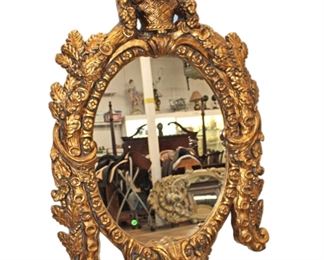 
Lot 606
Fancy carved and ornate composition decorator mirror

