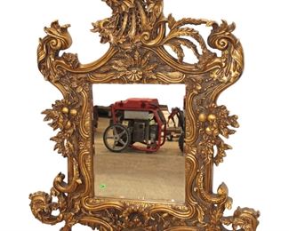 
Lot 607
Fancy carved and ornate composition decorator mirror

