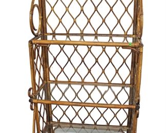 
Lot 664
Nice Vintage decorator bamboo frame glass shelf bakers rack
