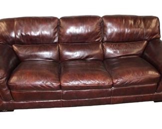 
Lot 672
Brown leather 3 cushion sofa
