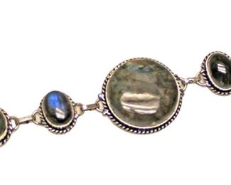 
Lot 691
Fiery blue flash labradorite and sterling bracelet approx. size 7"
