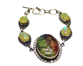 
Lot 700
Rainbow solar quartz and opal sterling silver bracelet approx. 8"
