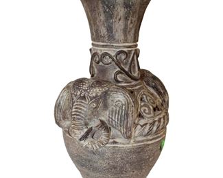 
Lot 713
Clay double handled elephant head case
