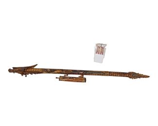 
Lot 722
Hand carved dragon blow gun made in Indonesia with 7 darts
